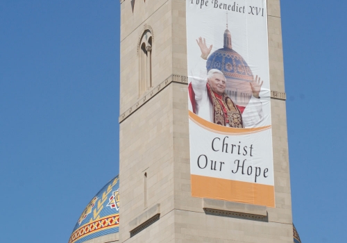 A banner on the bell tower of the Basilica of the National Shrine of the Immaculate Conception welcomes Pope Benedict XVI in 2008.