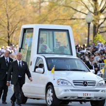 Pope Benedict XVI arrives in the Popemobile on the campus of Catholic University on April 16, 2008.