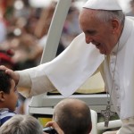 Pope blesses child