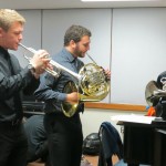 Orchestra members (From left) Matthew Fitzsimmons, Matthew Davis, and Christopher Gillie warm up in the piano lab at Ward Hall.