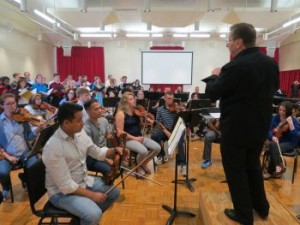 Dr. Leo Nestor, conductor of the University Chamber Choir, leads a joint rehearsal between the Symphony Orchestra and the Chamber Choir Sept. 17. 