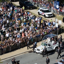 The Popemobile driving through CUA’s Campus