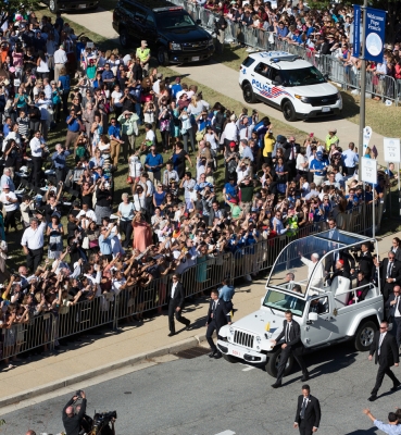 The Popemobile driving through CUA’s Campus