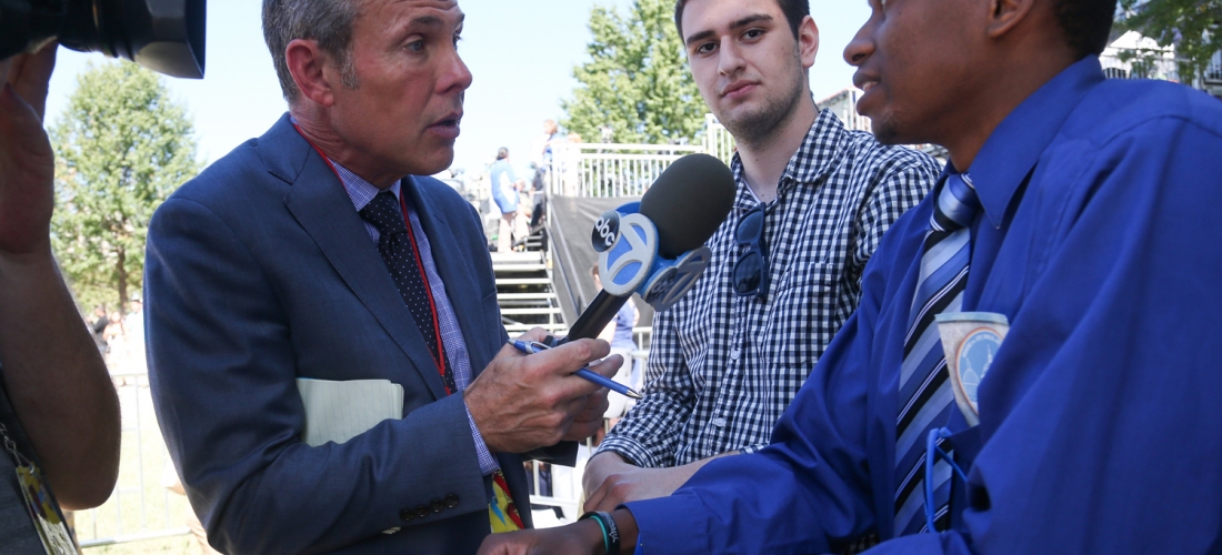 CBS News reporter interviews a CUA student