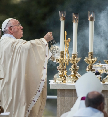 Pope Francis incenses the altar