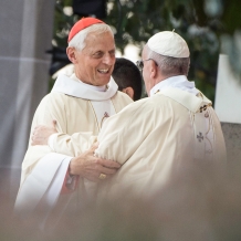 Cardinal Donald Wuerl embracing Pope Francis