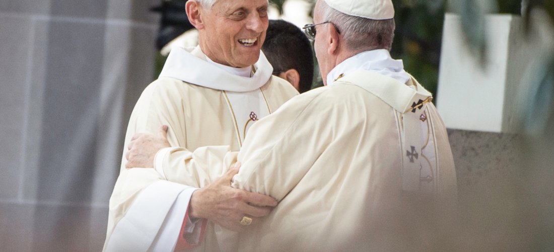 Cardinal Donald Wuerl embracing Pope Francis