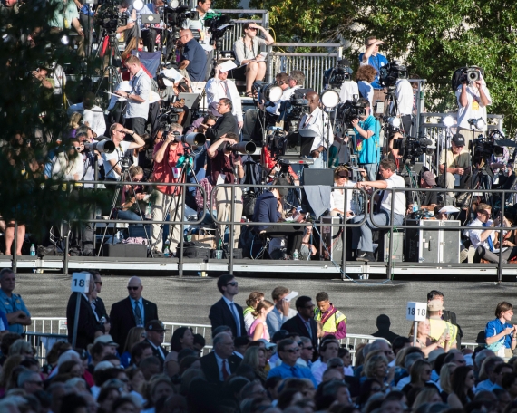 Media gathered on the riser directly across the University Mall from the papal altar.