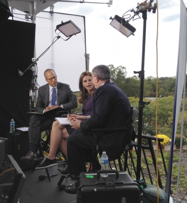 NBC News team conducting and interview on the roof of Father O’Connell Hall.