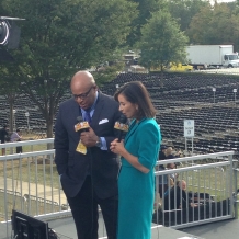 Reporters test their equipment on the riser before the Mass.