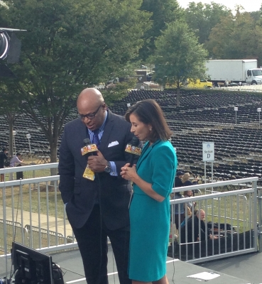 Reporters test their equipment on the riser before the Mass.