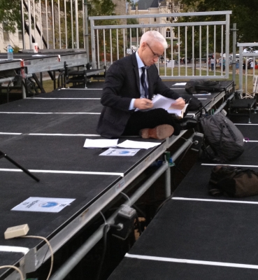 CNN’s Anderson Cooper prepares for his news show on the media riser.