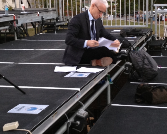 CNN’s Anderson Cooper prepares for his news show on the media riser.