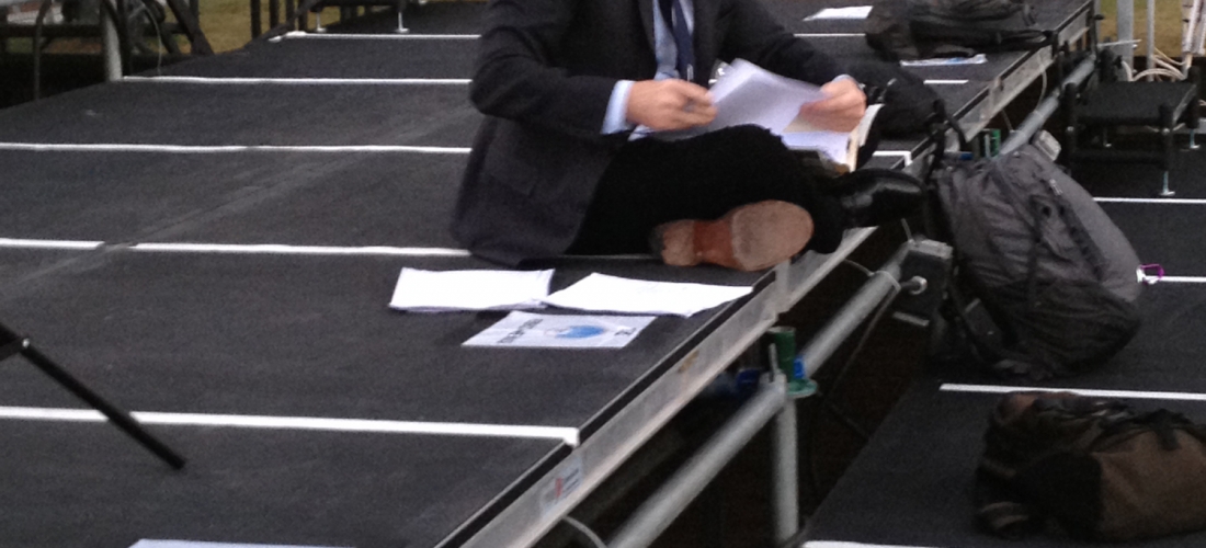 CNN’s Anderson Cooper prepares for his news show on the media riser.