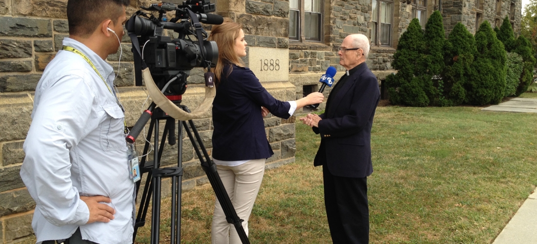 A media interview in front of Caldwell Hall.