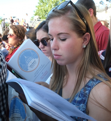 Students participate in the Mass, which was mostly in Spanish, using the bilingual Mass Program.