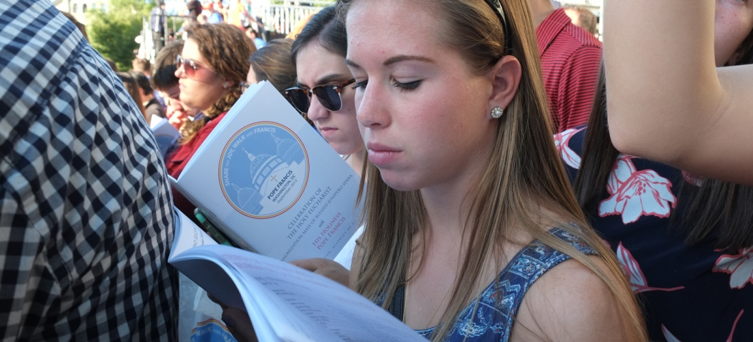 Students participate in the Mass, which was mostly in Spanish, using the bilingual Mass Program.