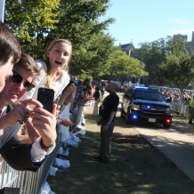 Leaning out over the fence on the University Mall to get a better view of Pope Francis.