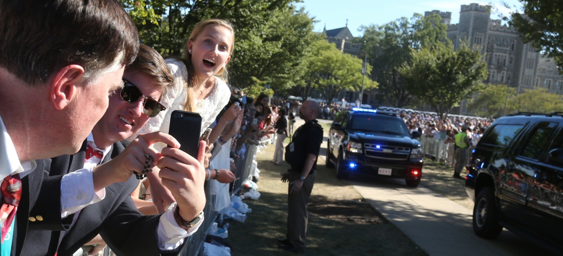 Leaning out over the fence on the University Mall to get a better view of Pope Francis.