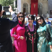 Getting their picture taken in front of the papal altar.