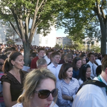 Some people in standing-room-only areas enjoyed shade from trees on the University Mall.