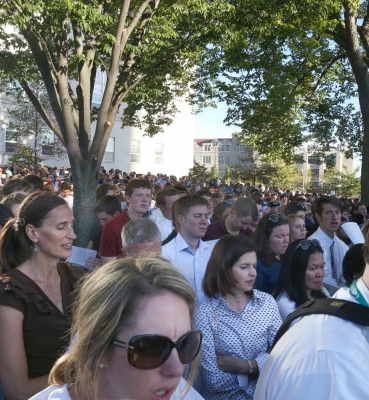 Some people in standing-room-only areas enjoyed shade from trees on the University Mall.