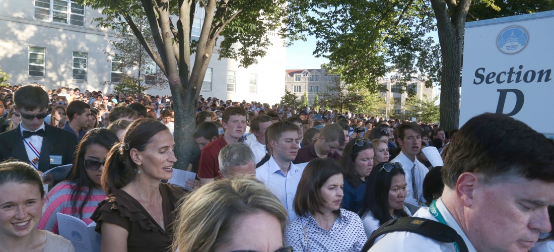 Some people in standing-room-only areas enjoyed shade from trees on the University Mall.