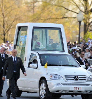 Pope Benedict XVI arrives in the Popemobile on the campus of Catholic University on April 16, 2008.