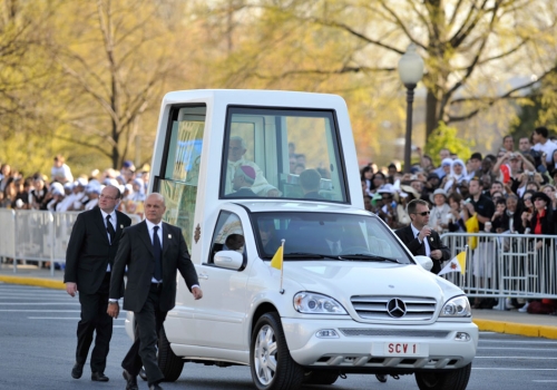 Pope Benedict XVI arrives in the Popemobile on the campus of Catholic University on April 16, 2008.