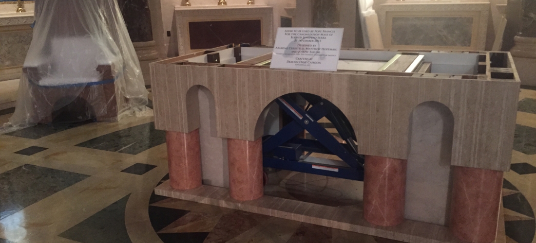 Altar designed by CUA students for the Pope’s Mass sits in the Basilica where it is being finished.