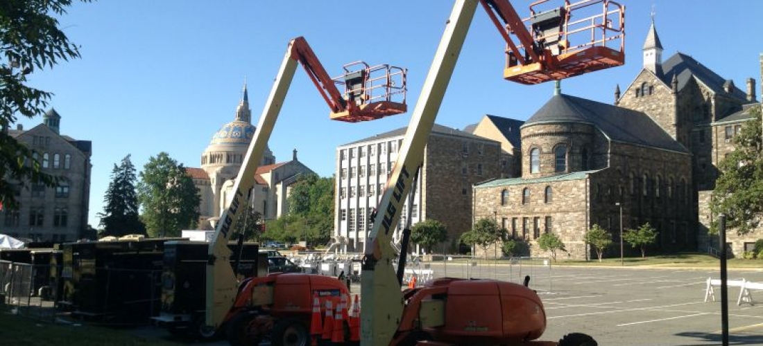 Construction equipment was moved into McMahon parking lot on Monday to begin getting ready for the Pope’s visit.