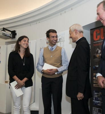 Cardinal Donald Wuerl congratulates the winning design team