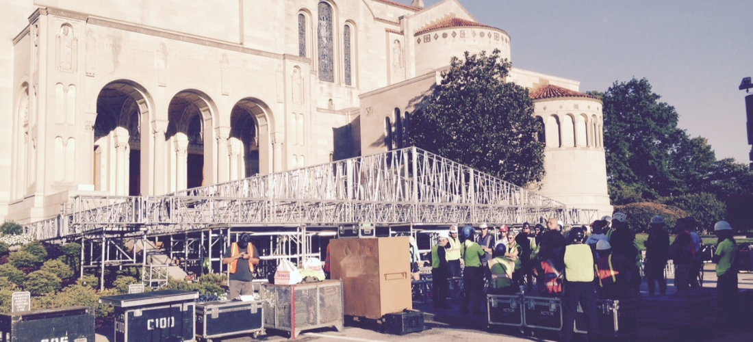 Preparing to raise the roof over the papal altar.