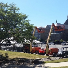 Preparation for the Pope’s visit begin in the parking lot behind McMahon Hall.