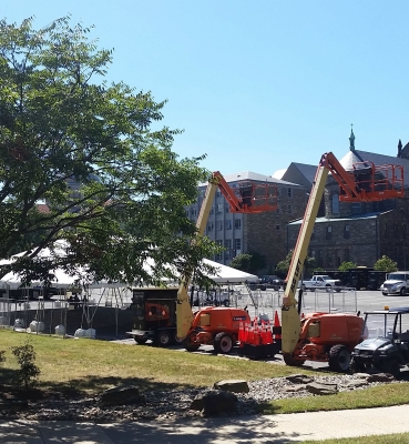 Preparation for the Pope’s visit begin in the parking lot behind McMahon Hall.