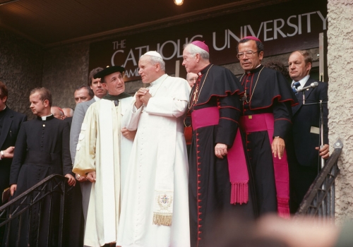 POPE JOHN PAUL II SPEAKS WITH THEN-PRESIDENT OF CATHOLIC UNIVERSITY EDMUND D. PELLEGRINO DURING HIS VISIT IN 1979.
